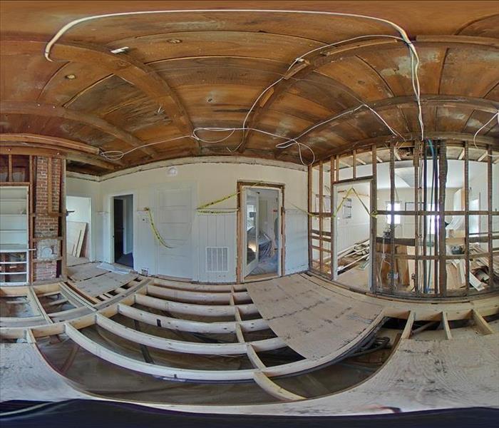 360-degree panoramic shot of a fully-demolished office space awaiting new floors and walls. Electrical and plumbing are also 