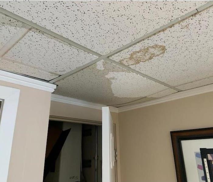 Commercial property with a water damaged ceiling with water spots
