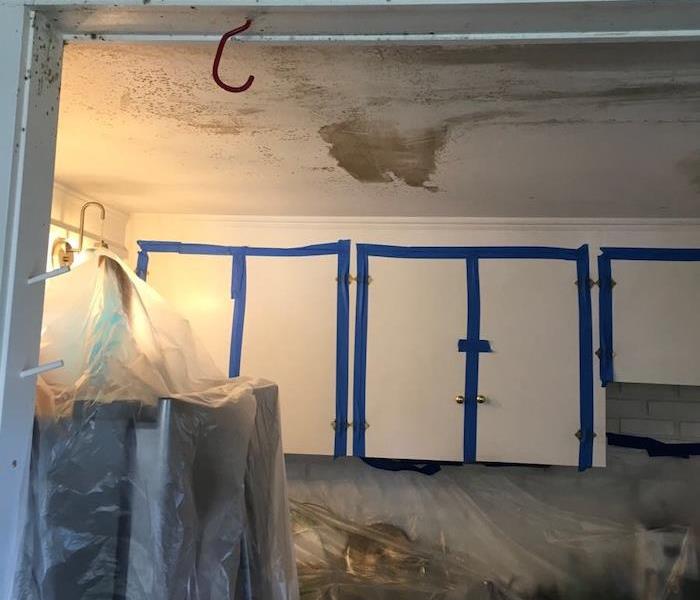 Room with mold damage on the ceiling