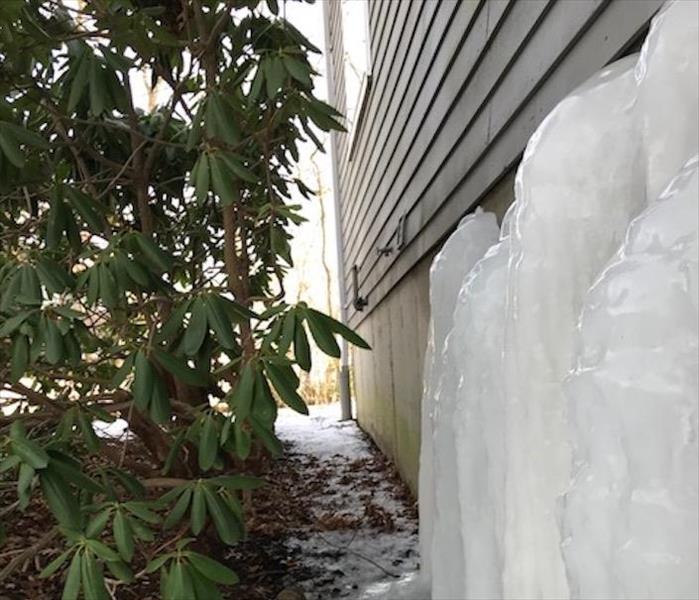 ice encrusted on side of house
