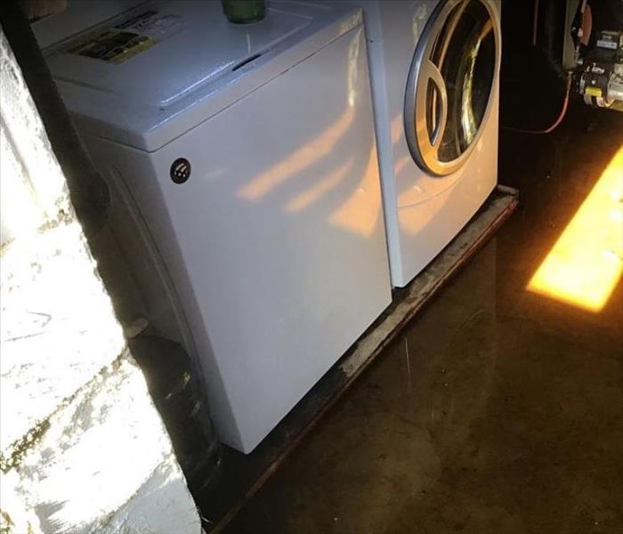 Washing machine and dryer; standing water on the floor