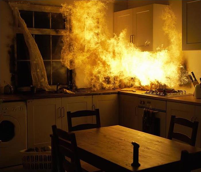 Fire raging in a kitchen